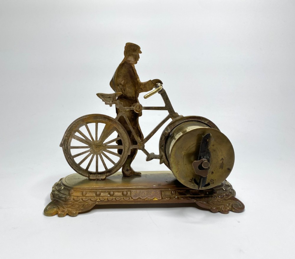 Brass cyclist and bicycle clock, England, c. 1910. View III