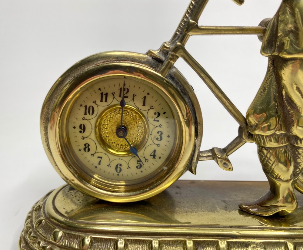 Brass cyclist and bicycle clock, England, c. 1910. View IV