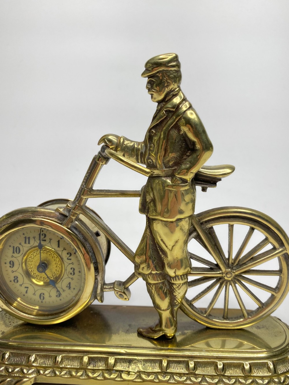 Brass cyclist and bicycle clock, England, c. 1910. View V