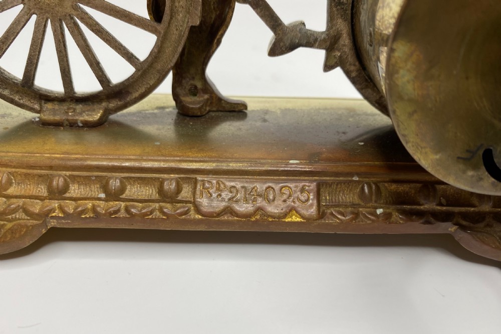 Brass cyclist and bicycle clock, England, c. 1910. View VII