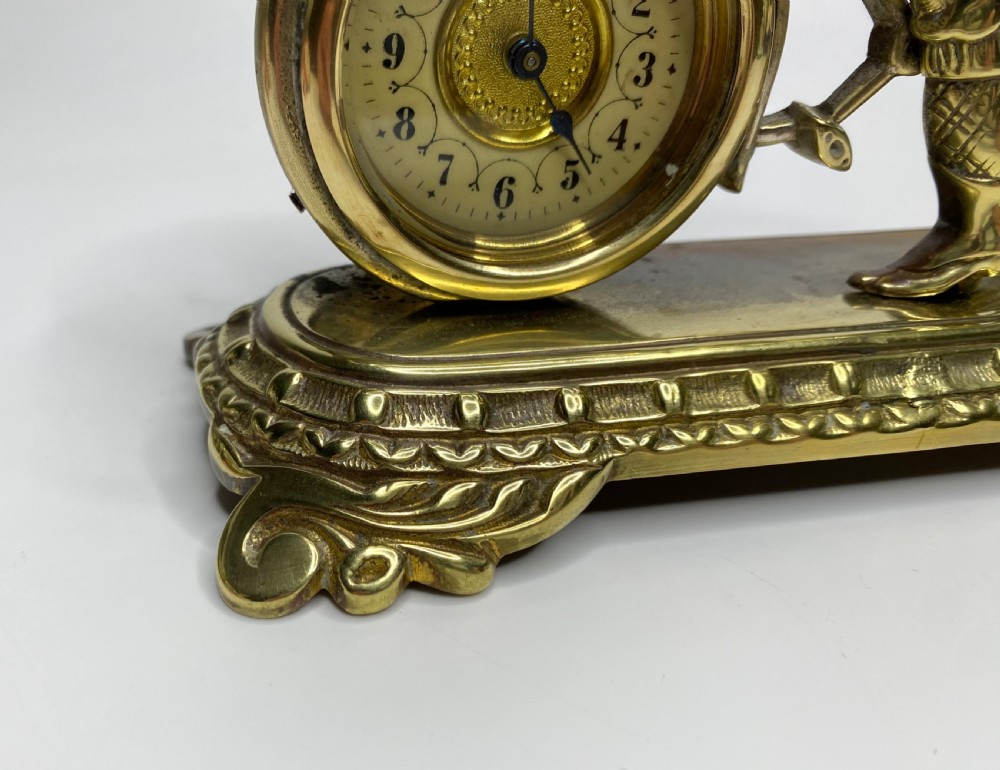 Brass cyclist and bicycle clock, England, c. 1910. View X