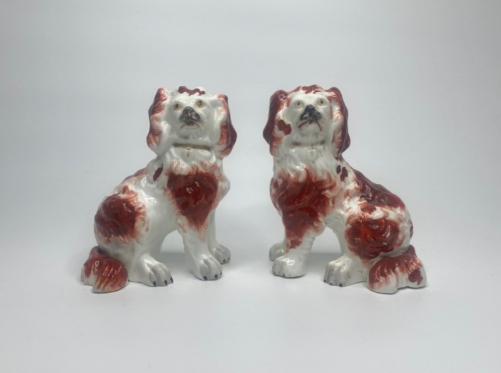 Pair Staffordshire porcellaneous Spaniels, c. 1840.