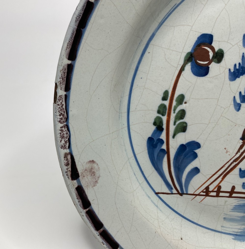Rare London Delft pancake plate, Long tailed bird, c. 1750. View IV