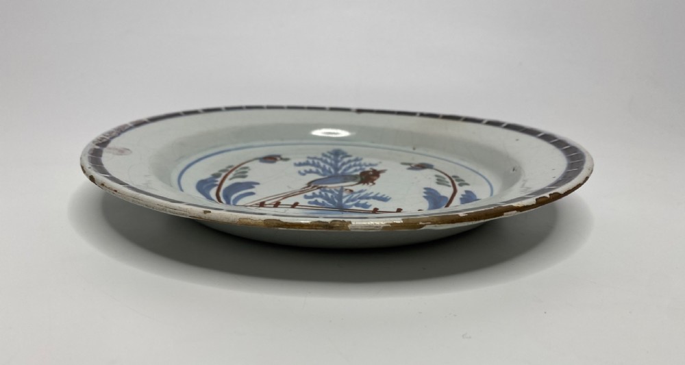 Rare London Delft pancake plate, Long tailed bird, c. 1750. View V