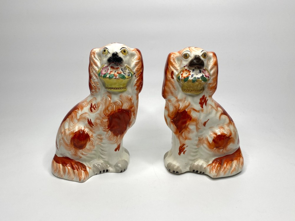 Pair Staffordshire ‘Basket of Flower’ Spaniels, c. 1860.