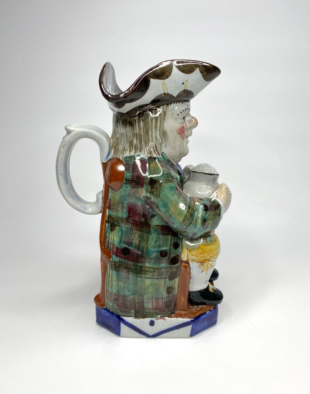 Staffordshire Tartan Coat Toby jug, c. 1830.