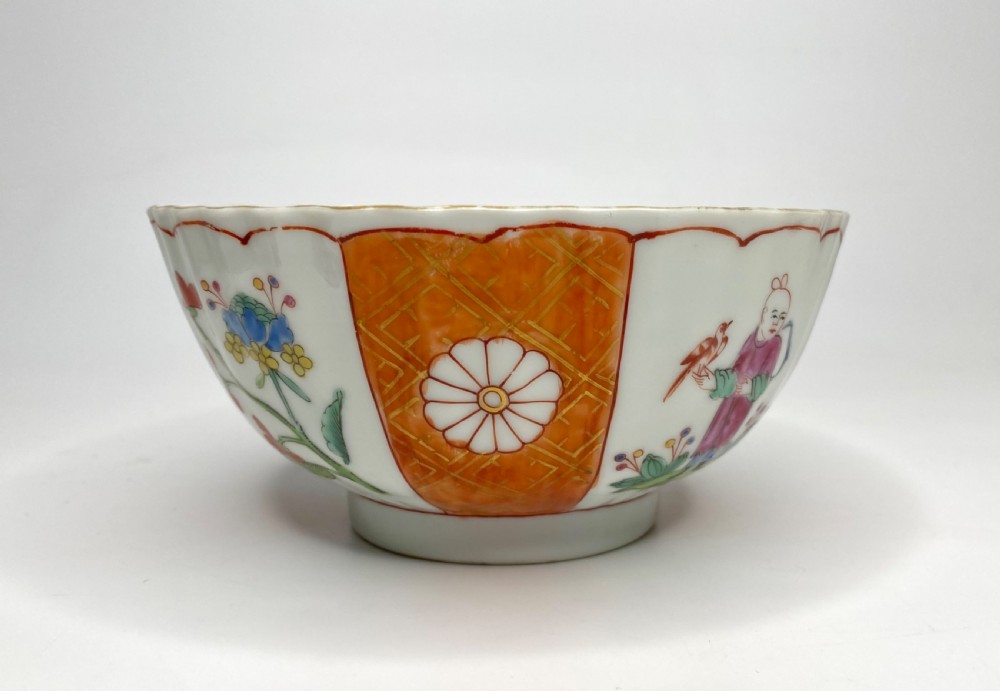 A fluted 18th-century Chinese porcelain bowl decorated in London with alternating panels of orange diaper work and hand-painted figures. View II