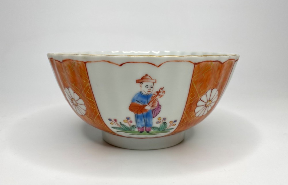 A fluted 18th-century Chinese porcelain bowl decorated in London with alternating panels of orange diaper work and hand-painted figures. View IV