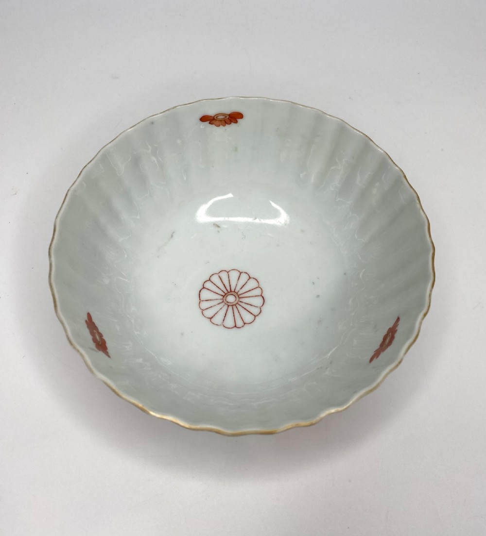 A fluted 18th-century Chinese porcelain bowl decorated in London with alternating panels of orange diaper work and hand-painted figures. View VI