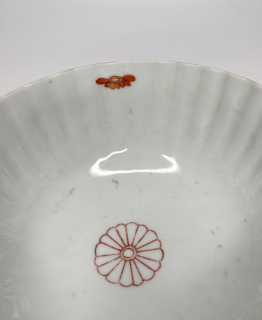 A fluted 18th-century Chinese porcelain bowl decorated in London with alternating panels of orange diaper work and hand-painted figures. View VII