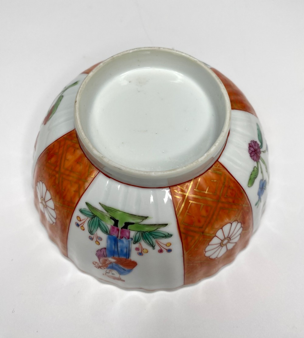 A fluted 18th-century Chinese porcelain bowl decorated in London with alternating panels of orange diaper work and hand-painted figures. View VIII