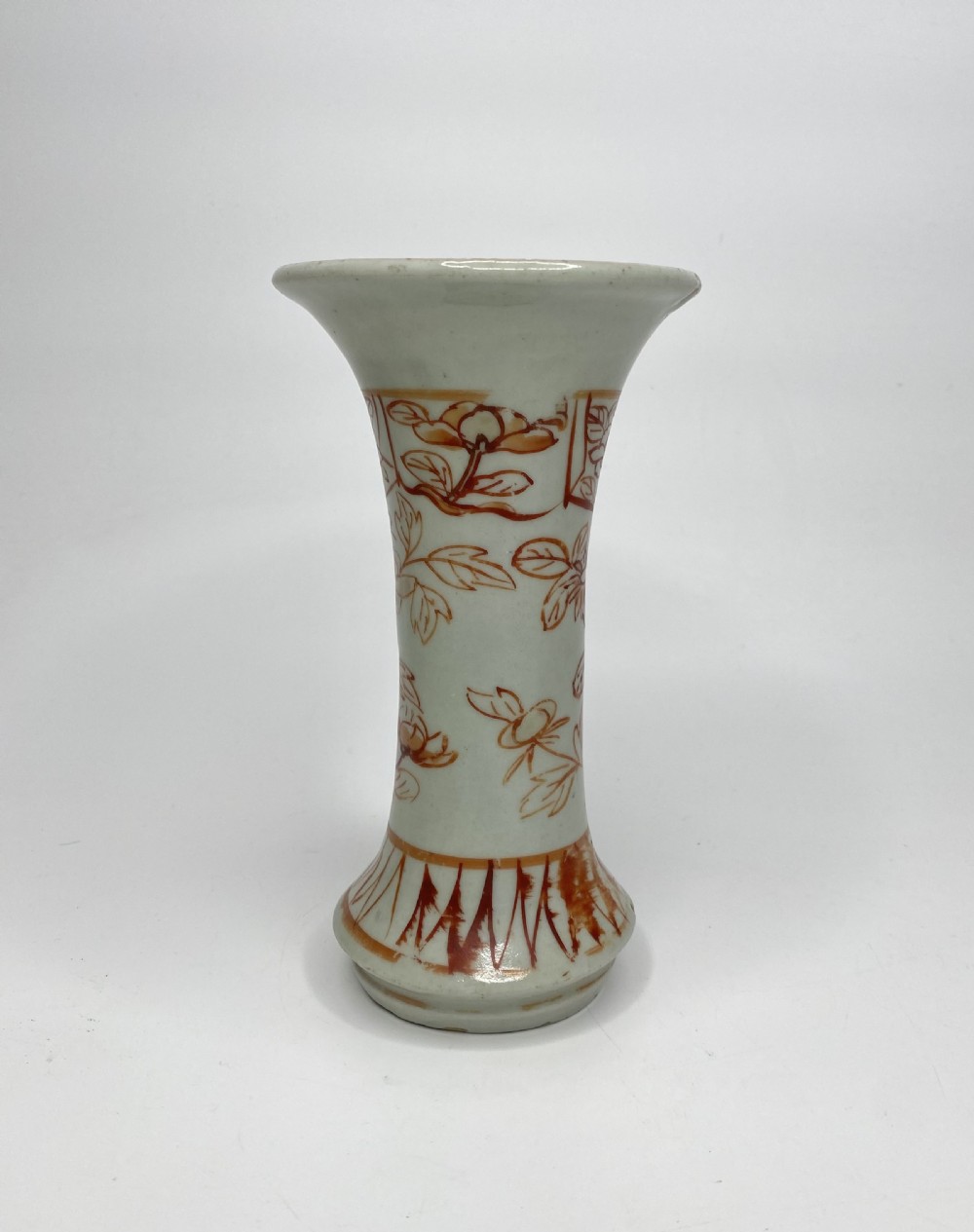 An 18th-century Japanese Arita porcelain beaker vase featuring flared rims and hand-painted iron red floral motifs over a white glaze. View III