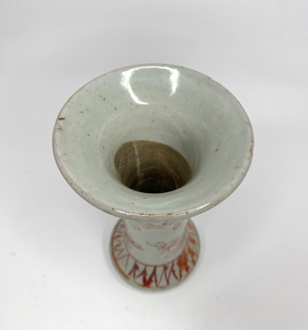 An 18th-century Japanese Arita porcelain beaker vase featuring flared rims and hand-painted iron red floral motifs over a white glaze. View VI