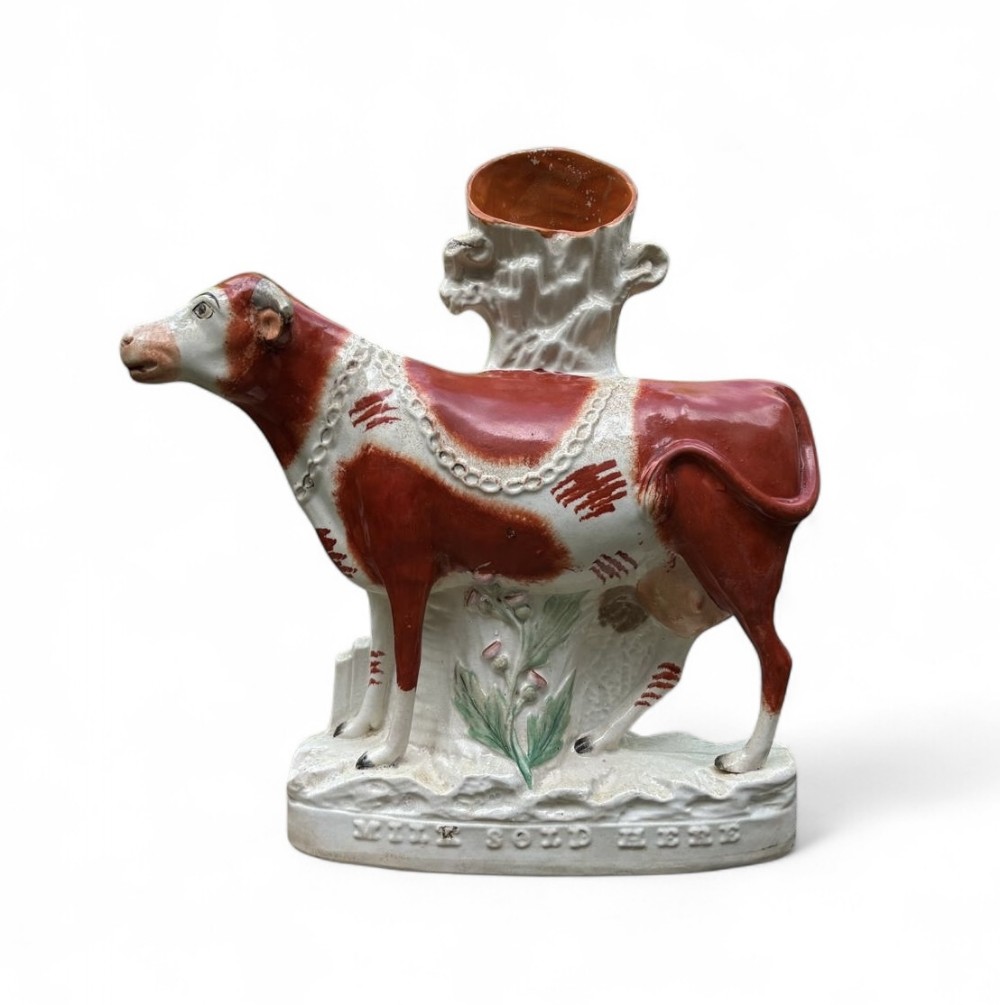 Staffordshire pottery MILK SOLD HERE spill vase, c. 1860.