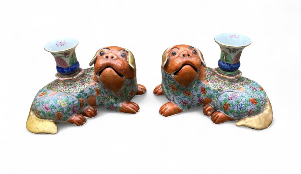 Pair Chinese porcelain pug dog candlesticks, c. 1840.