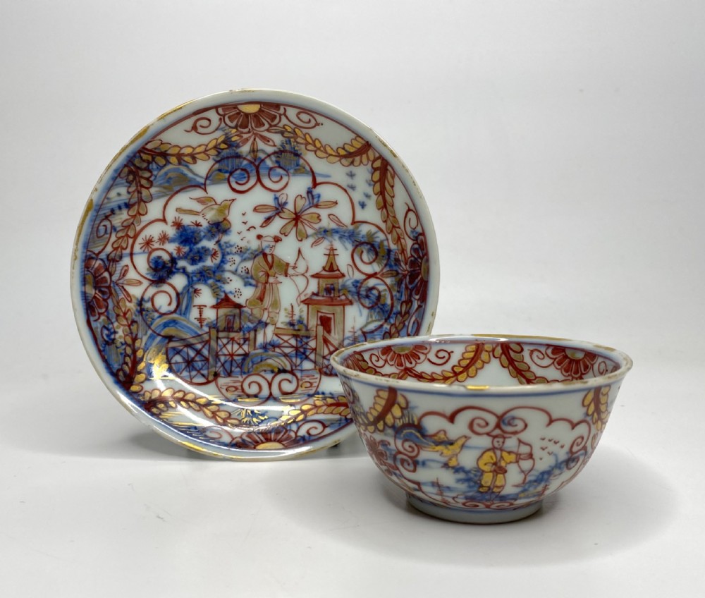An 18th-century Chinese export porcelain tea bowl and saucer with red, gold, and blue Amsterdams Bont enamel decoration.