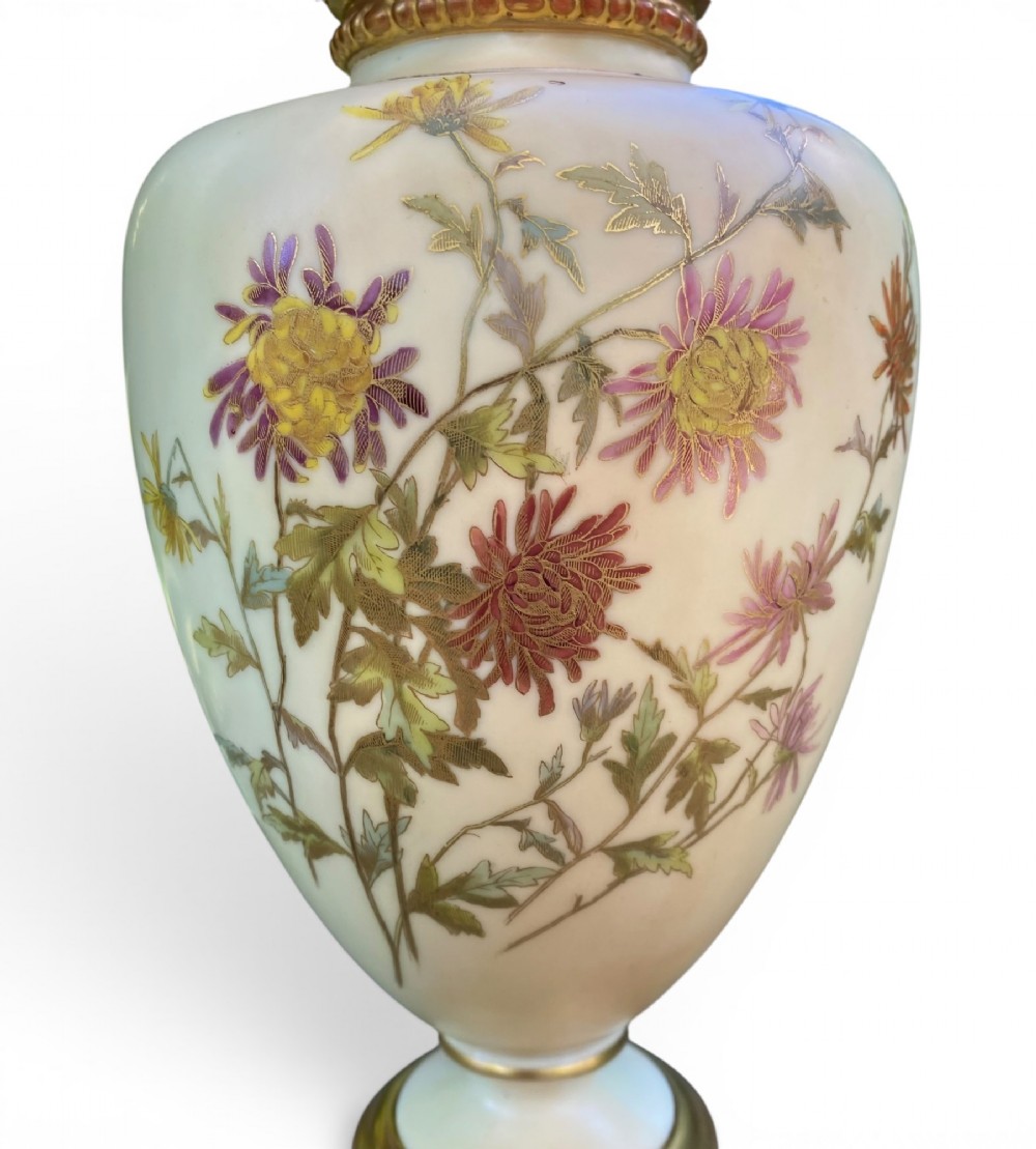 An urn-shaped ivory porcelain vase featuring hand-painted botanical chrysanthemum flowers, an ornate pierced crown rim, and gilded accents. View II