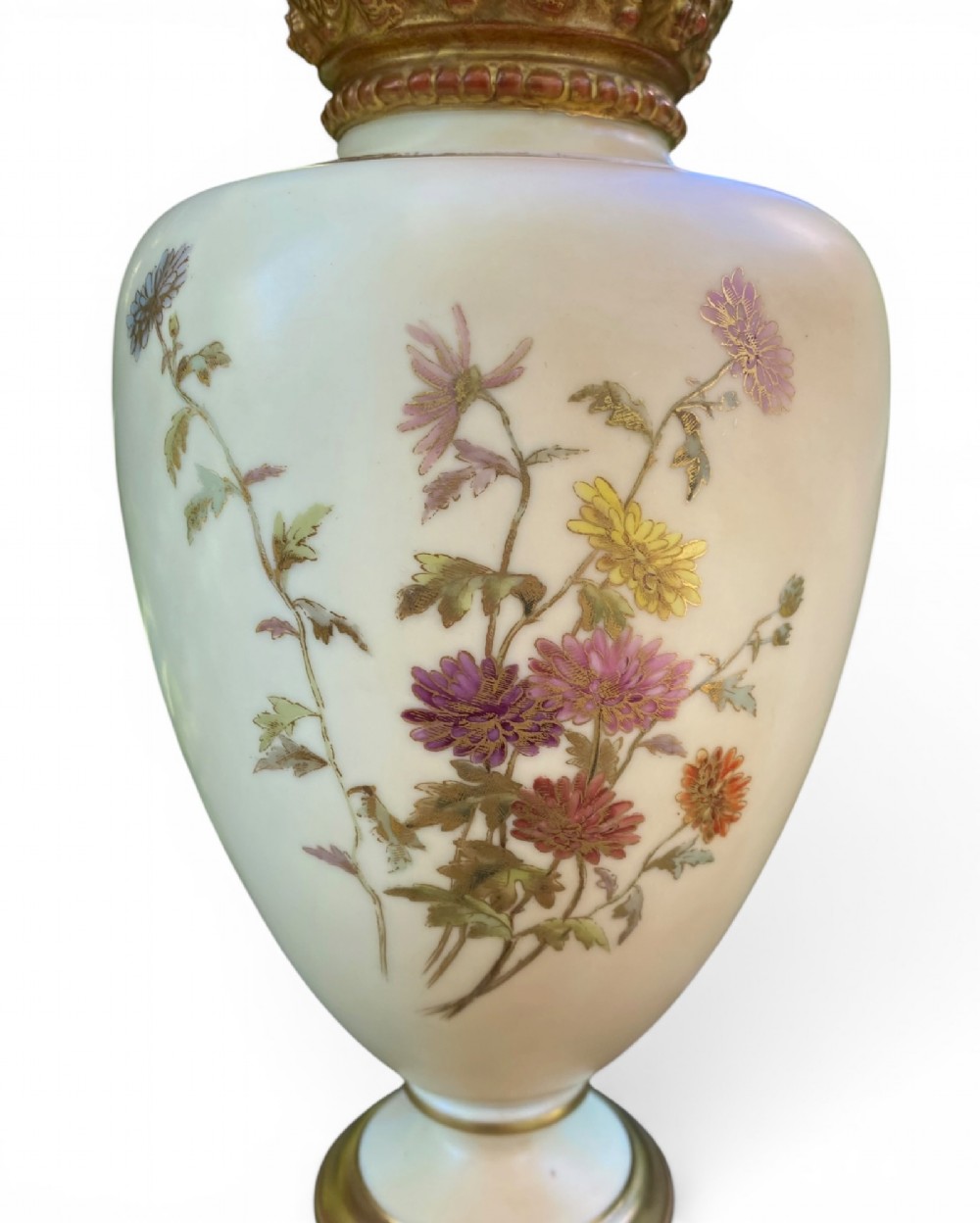 An urn-shaped ivory porcelain vase featuring hand-painted botanical chrysanthemum flowers, an ornate pierced crown rim, and gilded accents. View V