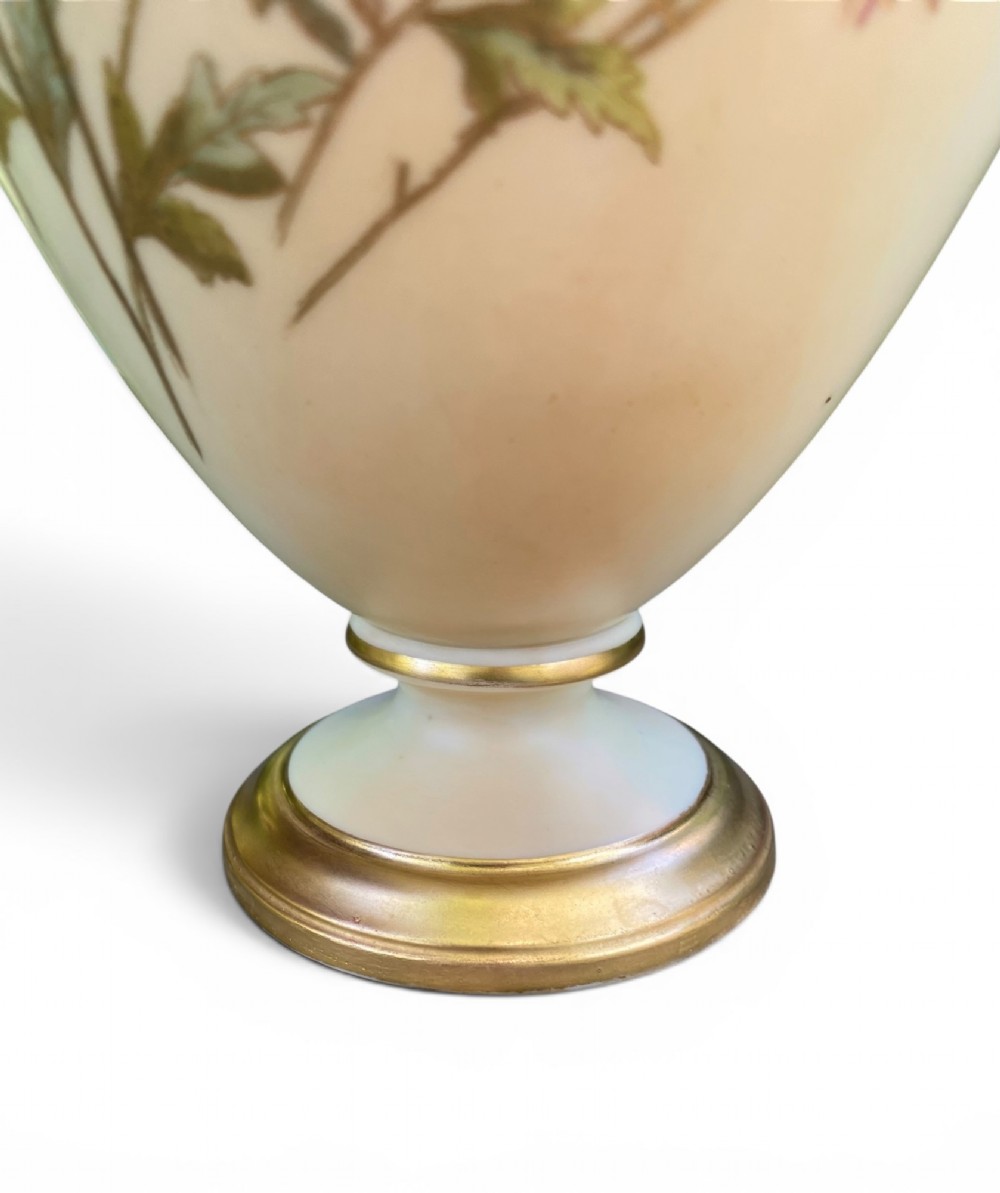 An urn-shaped ivory porcelain vase featuring hand-painted botanical chrysanthemum flowers, an ornate pierced crown rim, and gilded accents. View VII