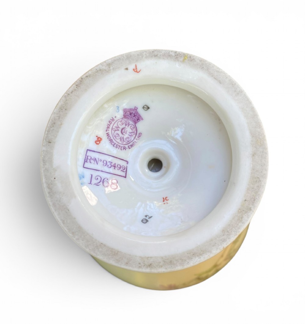 An urn-shaped ivory porcelain vase featuring hand-painted botanical chrysanthemum flowers, an ornate pierced crown rim, and gilded accents. View IX