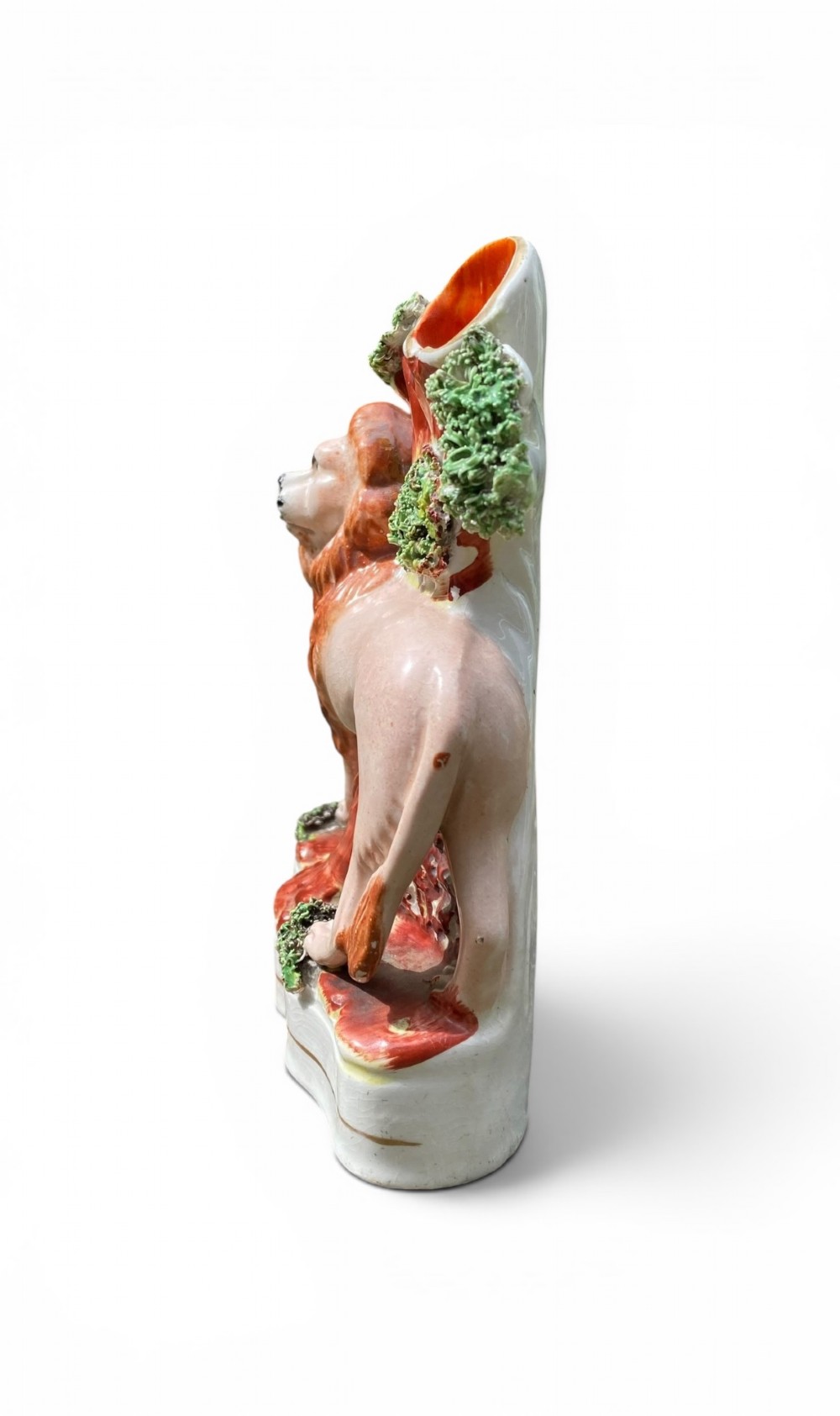 A pair of antique Victorian Staffordshire ceramic spill vases in the form of standing lions beside hollow tree trunks. View XII
