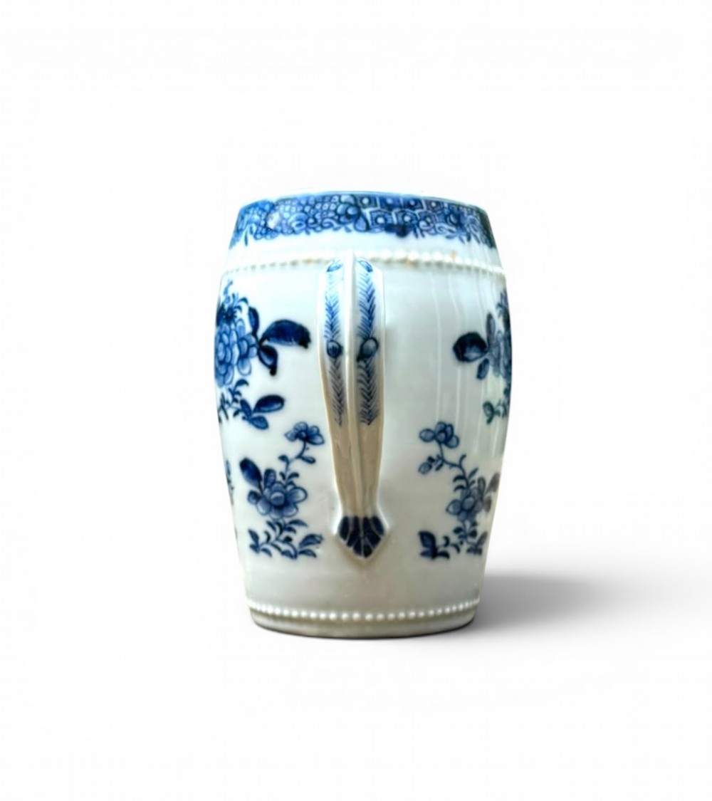 A barrel-shaped Chinese export porcelain mug decorated with a blue painted flower basket motif and raised beaded rims. View IV