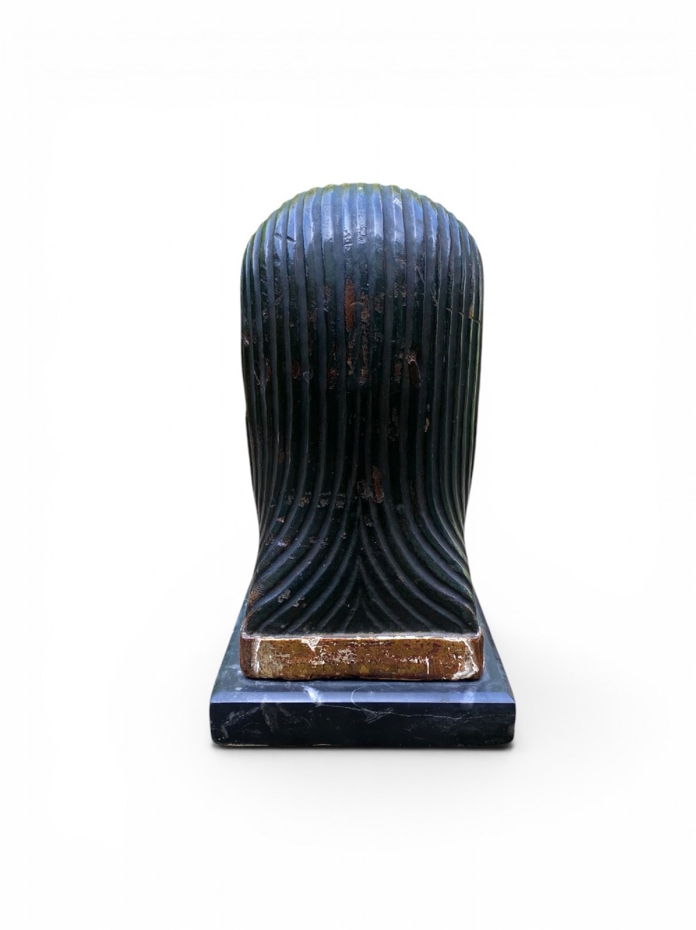 A facing pair of carved dark wood sphinx busts with gilt highlights mounted on rectangular black marble bases. View V