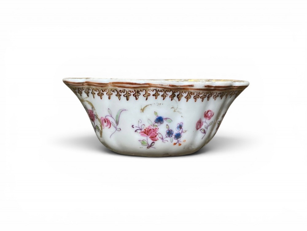 An 18th-century Chinese export famille rose porcelain ladle featuring a lobed white bowl painted with pink floral motifs and fitted with a dark turned handle. View III