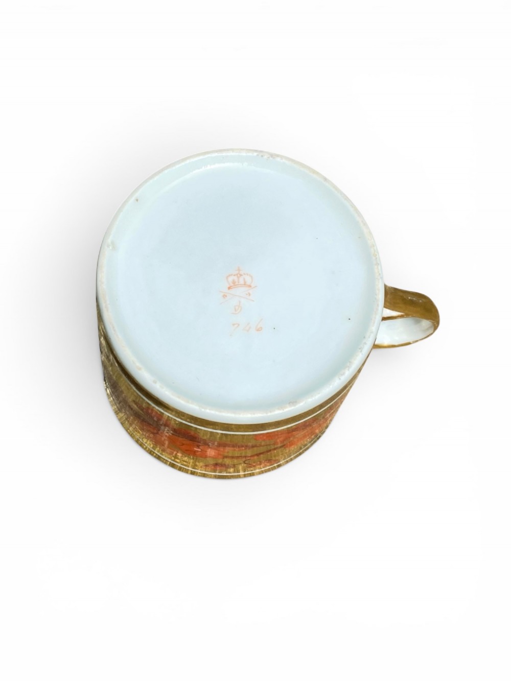 A Regency period Derby porcelain trio featuring two cups and a matching saucer decorated with red oak leaves and heavy gilding. View VI