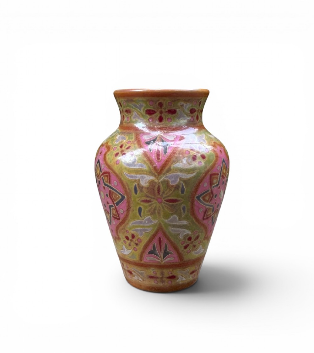 A baluster-shaped ceramic vase featuring intricate Persian-style geometric star medallions and foliate patterns in pink, olive green, and yellow lustre glazes. View II