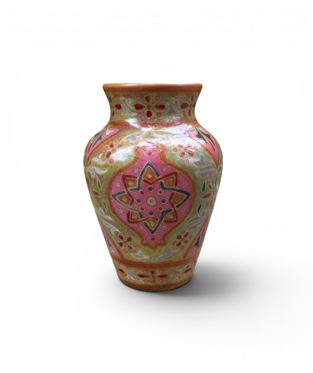 A baluster-shaped ceramic vase featuring intricate Persian-style geometric star medallions and foliate patterns in pink, olive green, and yellow lustre glazes. View III