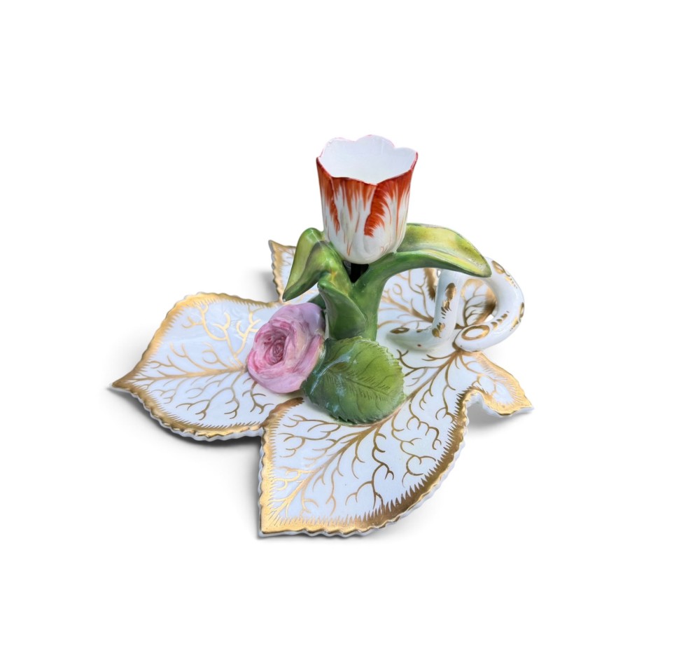An English porcelain chamberstick designed as a leaf base with a central tulip-shaped candle sconce hand-painted in red, green, pink, and gold. View II