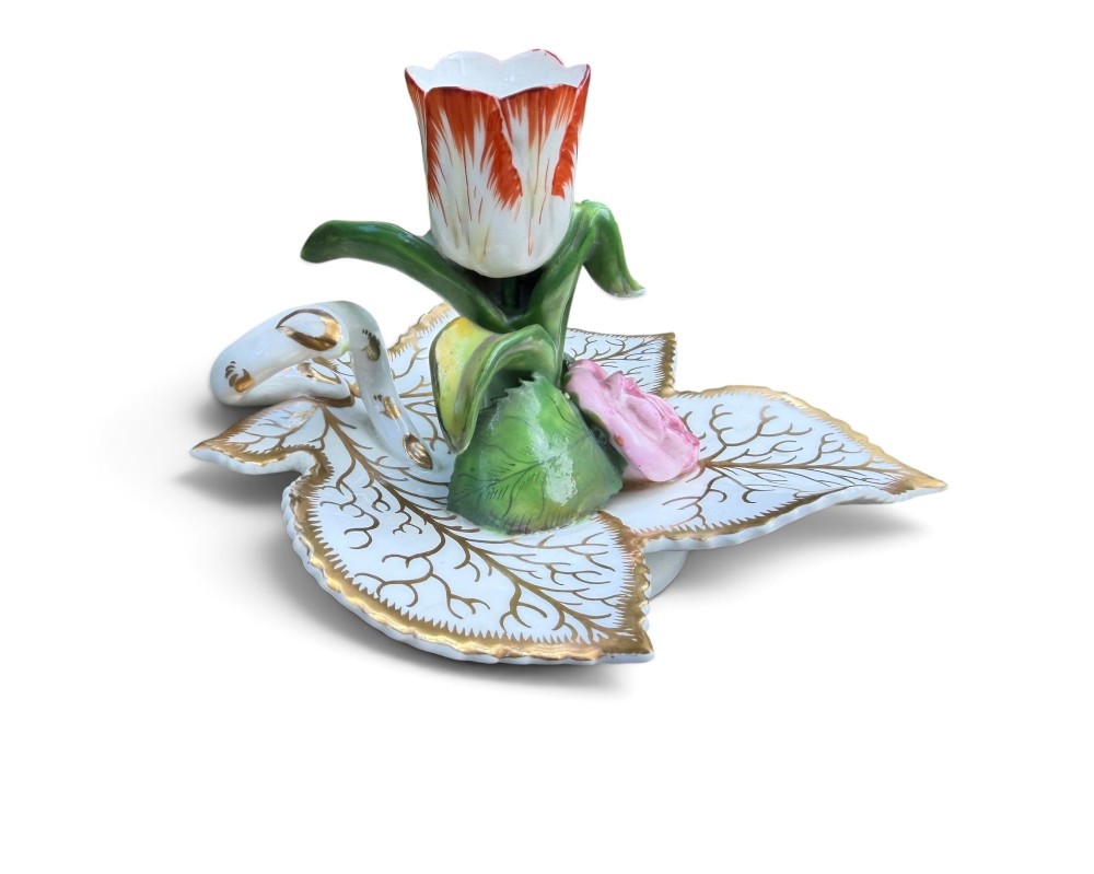 An English porcelain chamberstick designed as a leaf base with a central tulip-shaped candle sconce hand-painted in red, green, pink, and gold. View V
