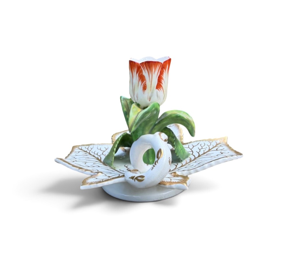 An English porcelain chamberstick designed as a leaf base with a central tulip-shaped candle sconce hand-painted in red, green, pink, and gold. View VI