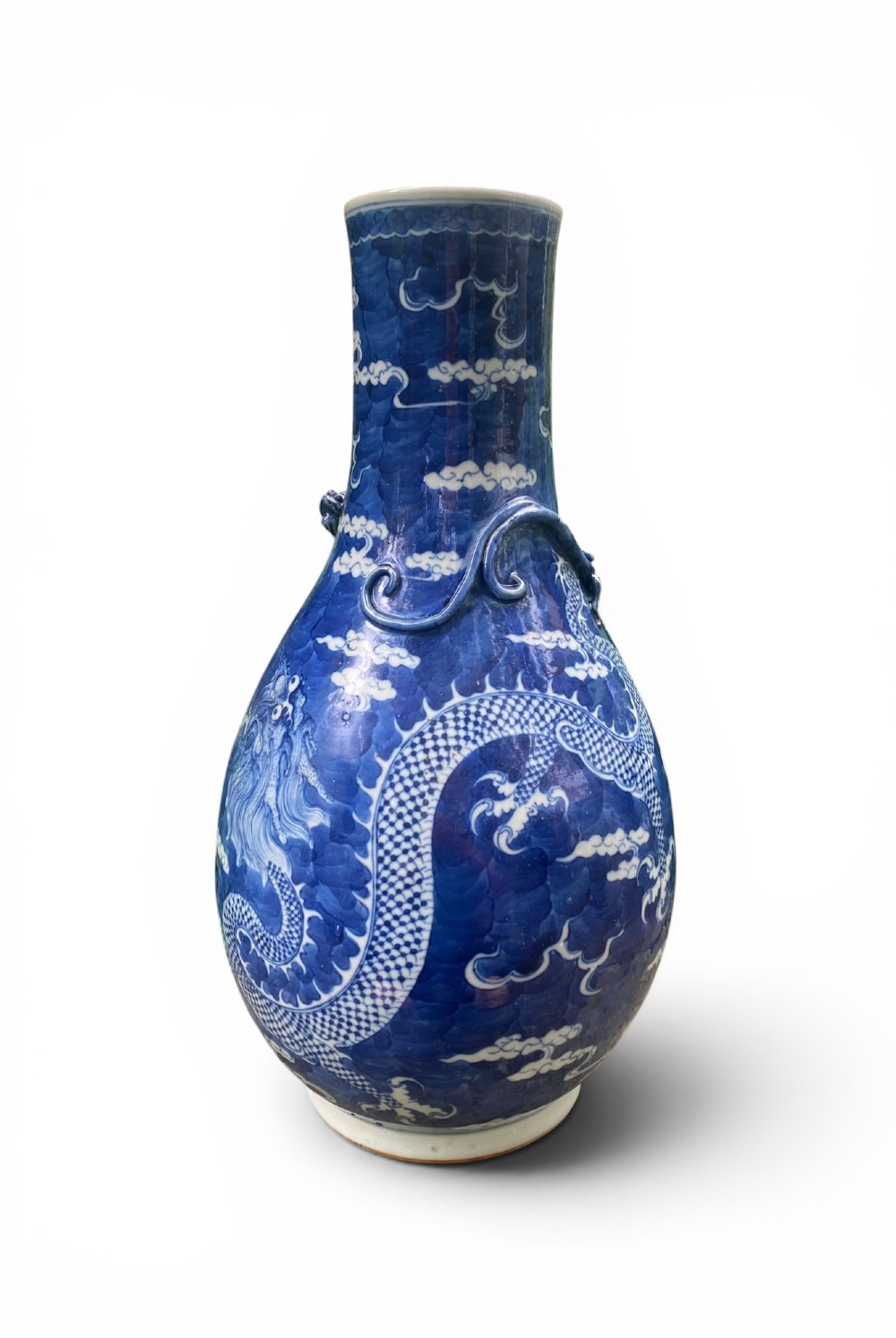 A 19th-century Qing Dynasty Chinese blue and white porcelain vase with hand-painted cloud motifs and an applied sculpted high-relief dragon around the neck. View IV
