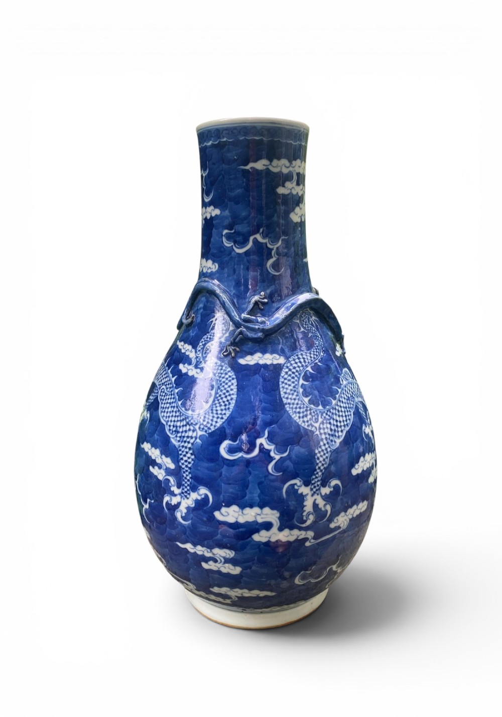 A 19th-century Qing Dynasty Chinese blue and white porcelain vase with hand-painted cloud motifs and an applied sculpted high-relief dragon around the neck. View VII