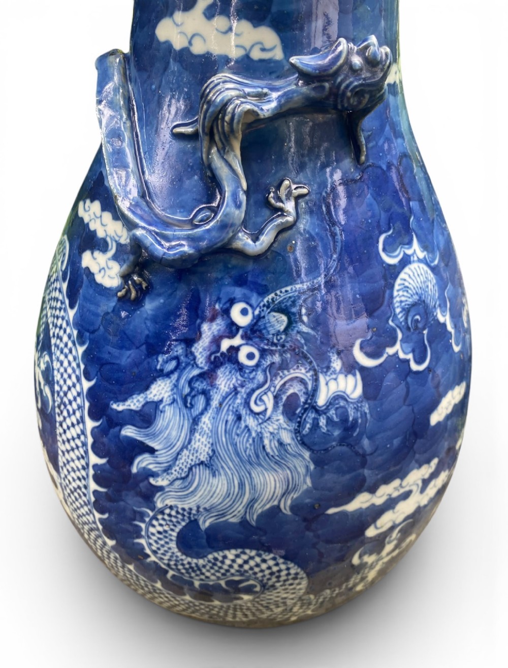 A 19th-century Qing Dynasty Chinese blue and white porcelain vase with hand-painted cloud motifs and an applied sculpted high-relief dragon around the neck. View XIII