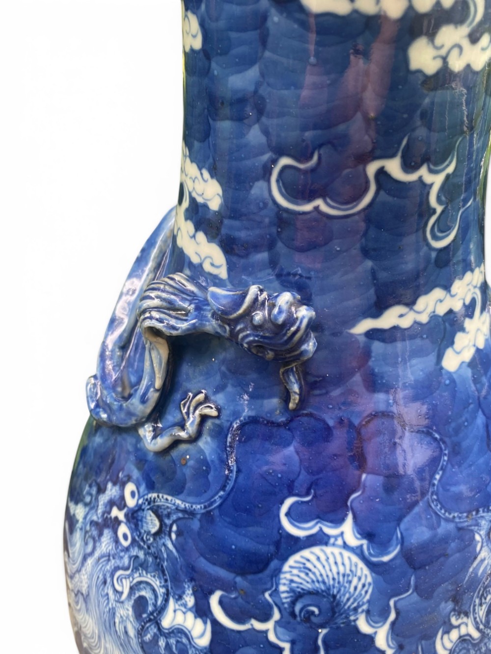 A 19th-century Qing Dynasty Chinese blue and white porcelain vase with hand-painted cloud motifs and an applied sculpted high-relief dragon around the neck. View XIV