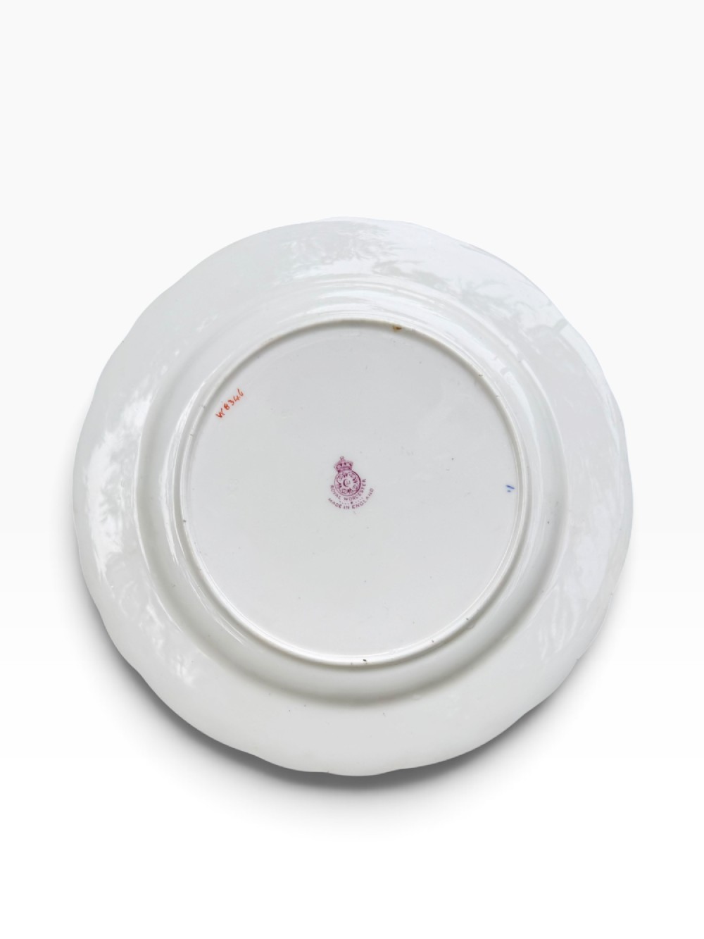 A circular Royal Worcester porcelain cabinet plate featuring a central hand-painted fruit study surrounded by an ornate cobalt blue and gilded rim. View VII
