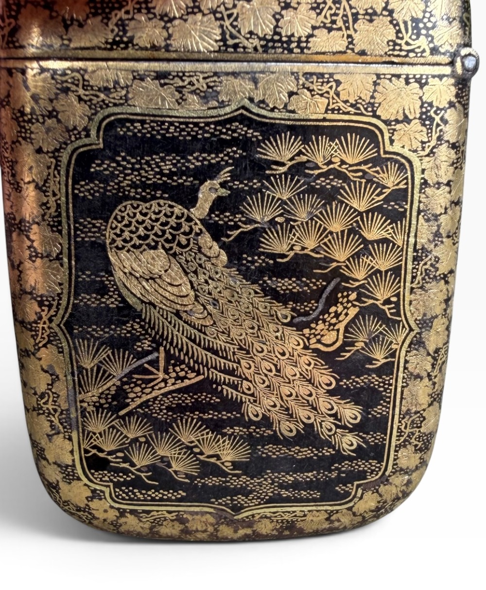 An antique Japanese Meiji period rectangular vesta case with rounded corners, featuring detailed gold damascene peacock and flora inlay on a dark iron surface. View V