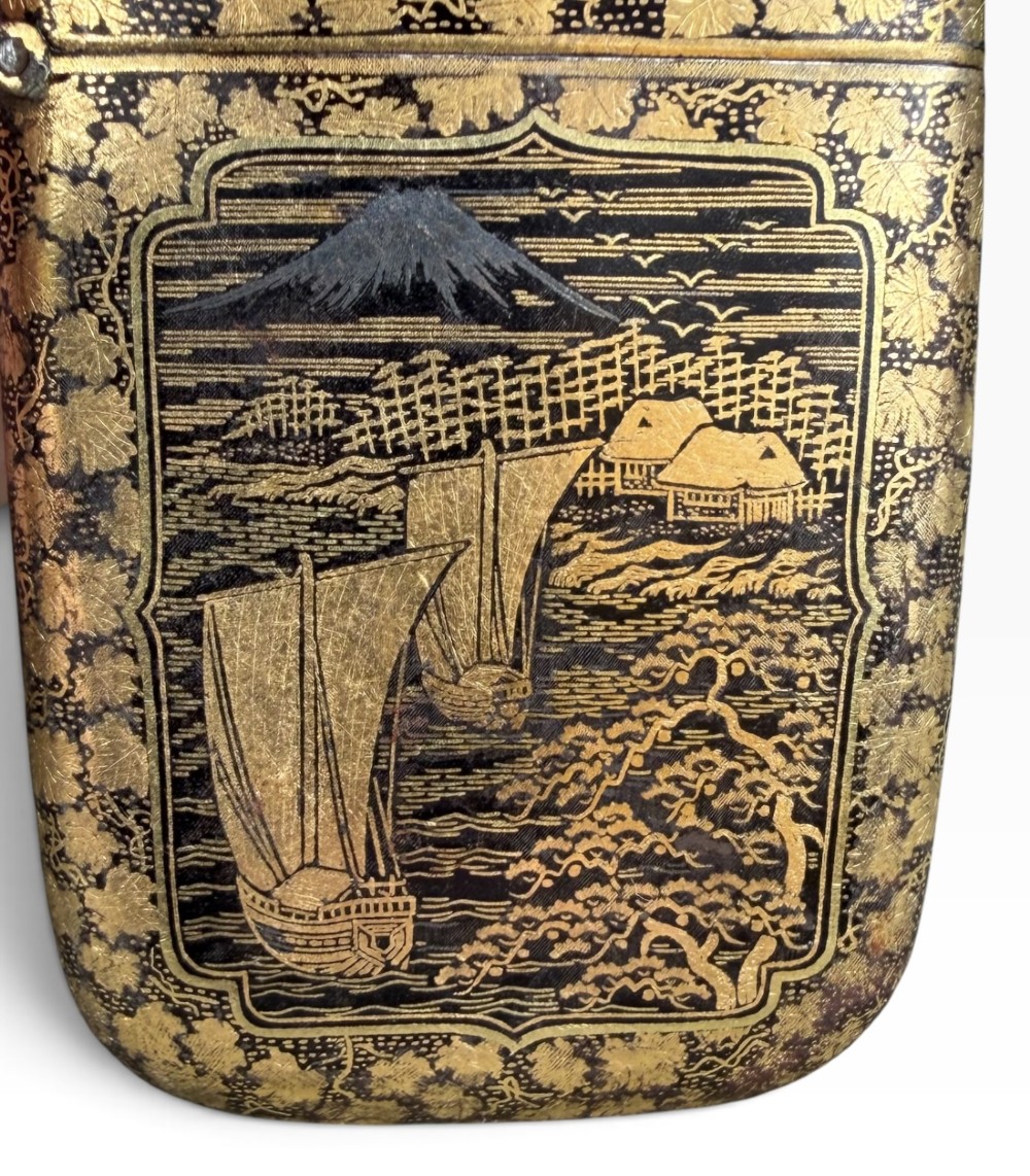 An antique Japanese Meiji period rectangular vesta case with rounded corners, featuring detailed gold damascene peacock and flora inlay on a dark iron surface. View VI