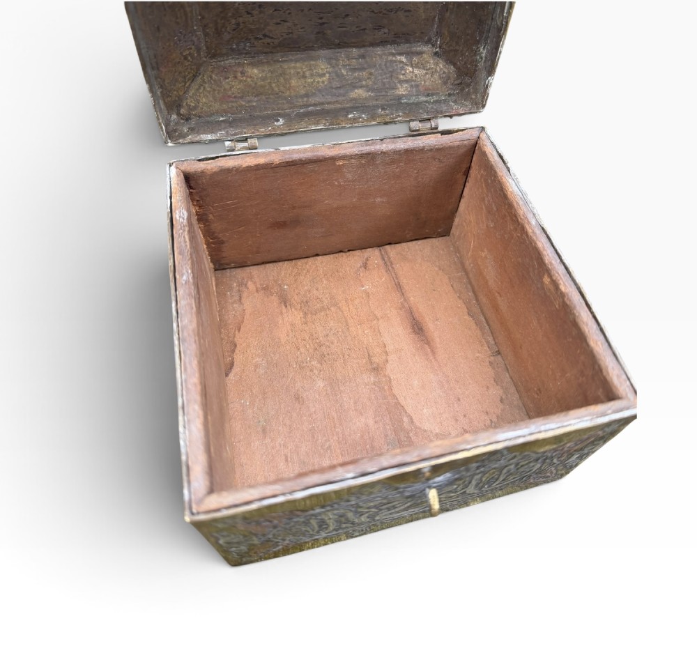 A square brass Quran casket featuring intricate silver and copper inlaid Arabic calligraphy and geometric interlace patterns. View XI