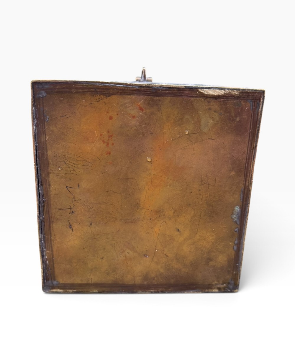 A square brass Quran casket featuring intricate silver and copper inlaid Arabic calligraphy and geometric interlace patterns. View XII
