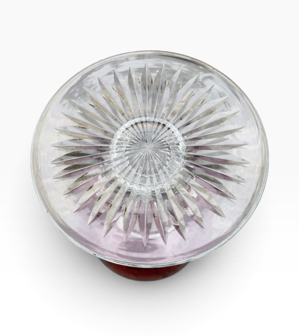 A Victorian cranberry glass goblet with intricately wheel-engraved Masonic symbols on a red bowl, supported by a clear knopped glass stem and a star-cut circular base. View XIV