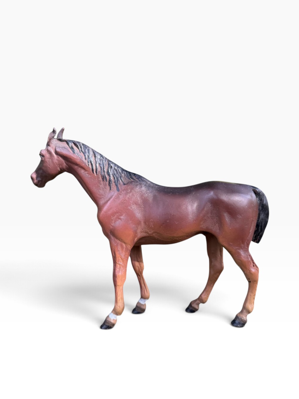 An antique Austrian cold-painted bronze figurine depicting a standing brown horse with a black mane and tail. View II