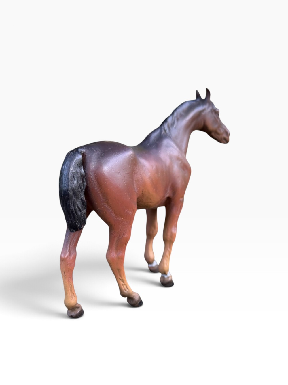 An antique Austrian cold-painted bronze figurine depicting a standing brown horse with a black mane and tail. View III