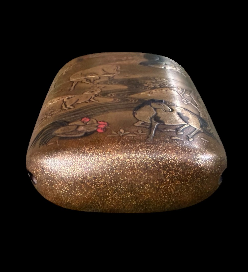 A multi-tiered Japanese gold maki-e lacquer inro featuring detailed relief depictions of zodiac animals including an ox, rabbit, rat, snake, and tiger. View IX