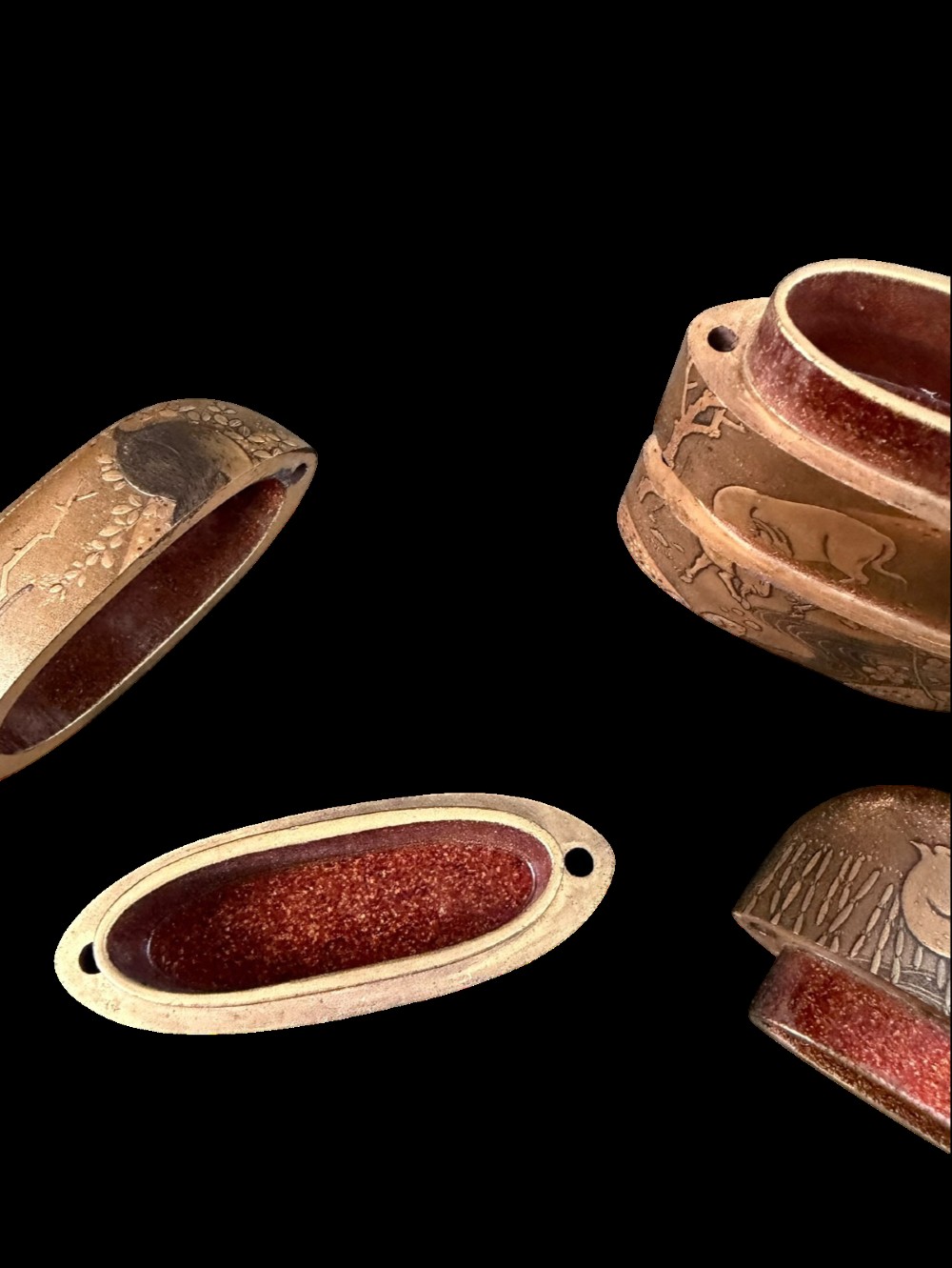 A multi-tiered Japanese gold maki-e lacquer inro featuring detailed relief depictions of zodiac animals including an ox, rabbit, rat, snake, and tiger. View XI