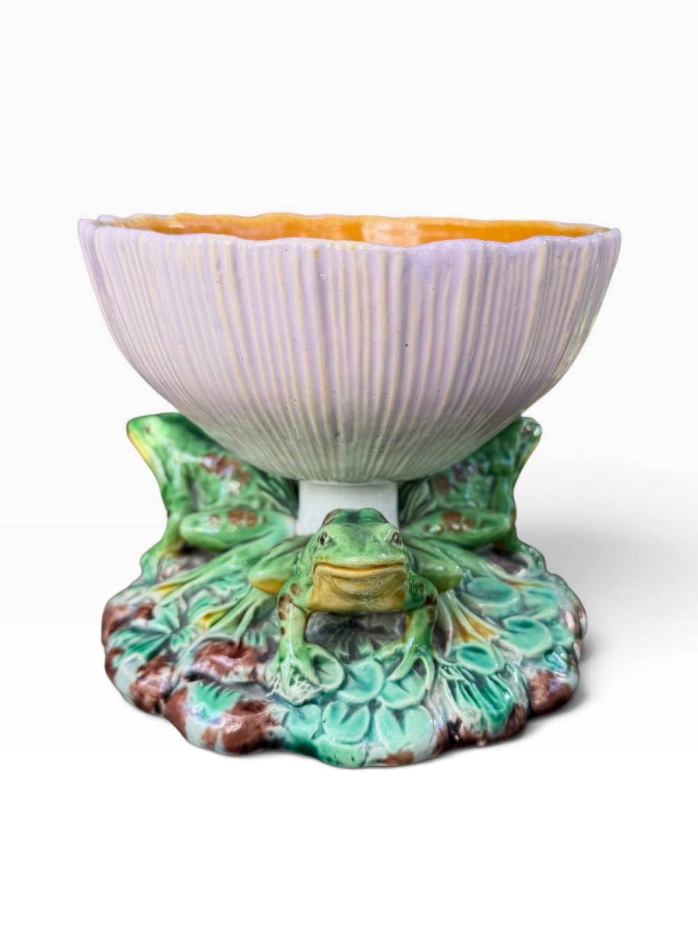 A Victorian Minton majolica footed bowl featuring three-dimensional green frogs on a leafy base supporting a fluted lilac flower-form bowl with a yellow glazed interior. View III
