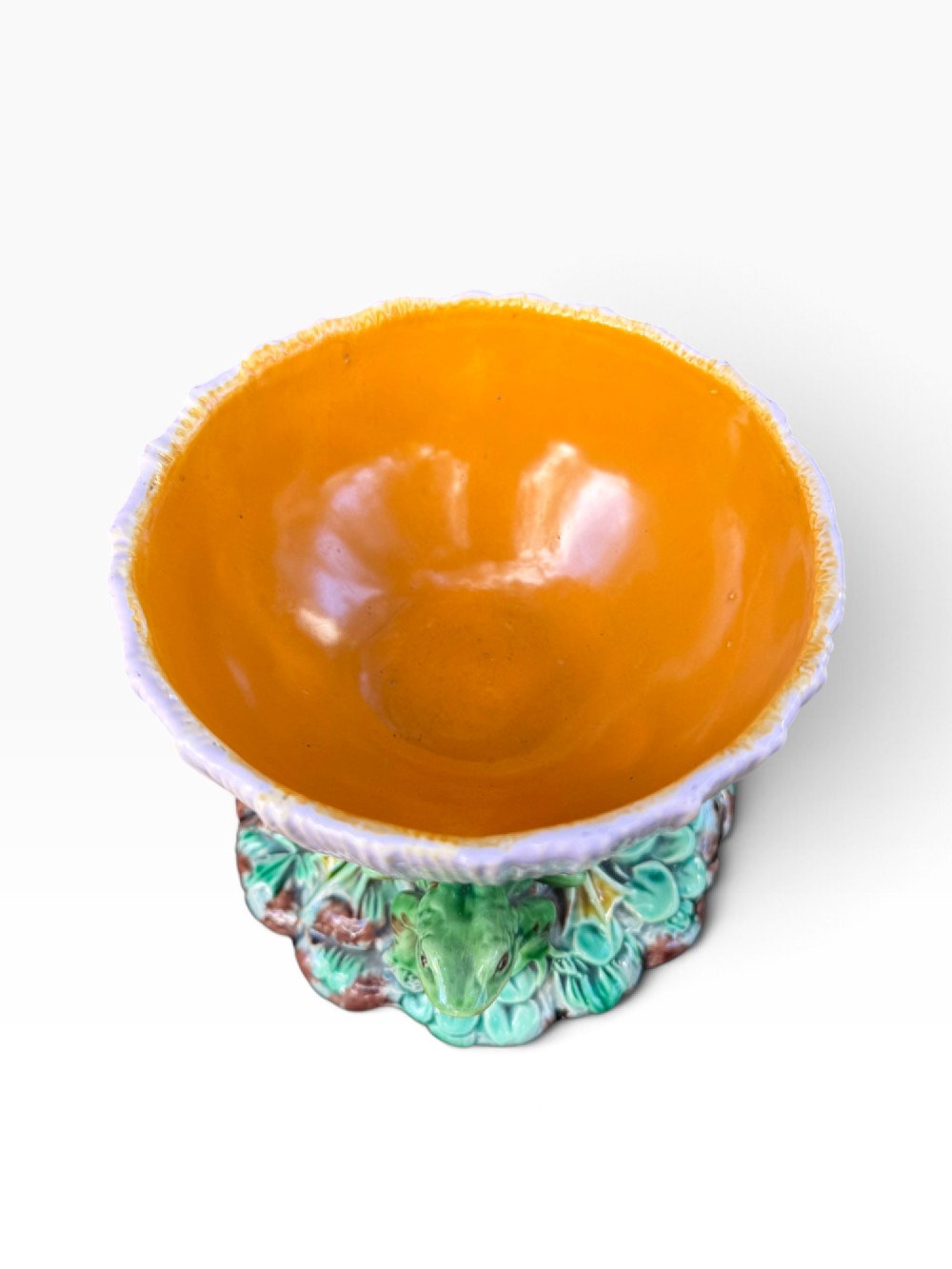 A Victorian Minton majolica footed bowl featuring three-dimensional green frogs on a leafy base supporting a fluted lilac flower-form bowl with a yellow glazed interior. View VII